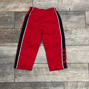 Nike Red and Black Joggers with Sporty Stripes